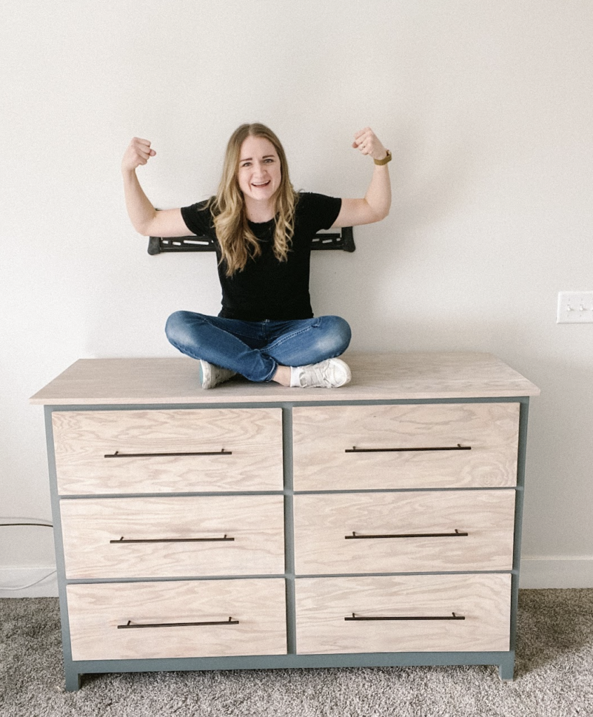 Woman sitting on DIY dresser