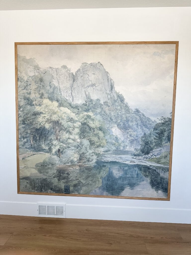 I framed my peel-and-stick wallpaper mural with wood to make it look like art!