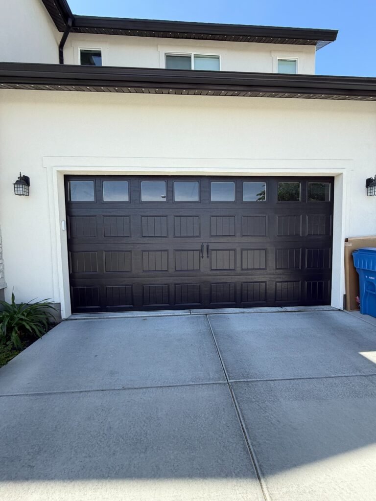 This was our home before, without a pergola. The wood really brightens up the white stucco and black garage.