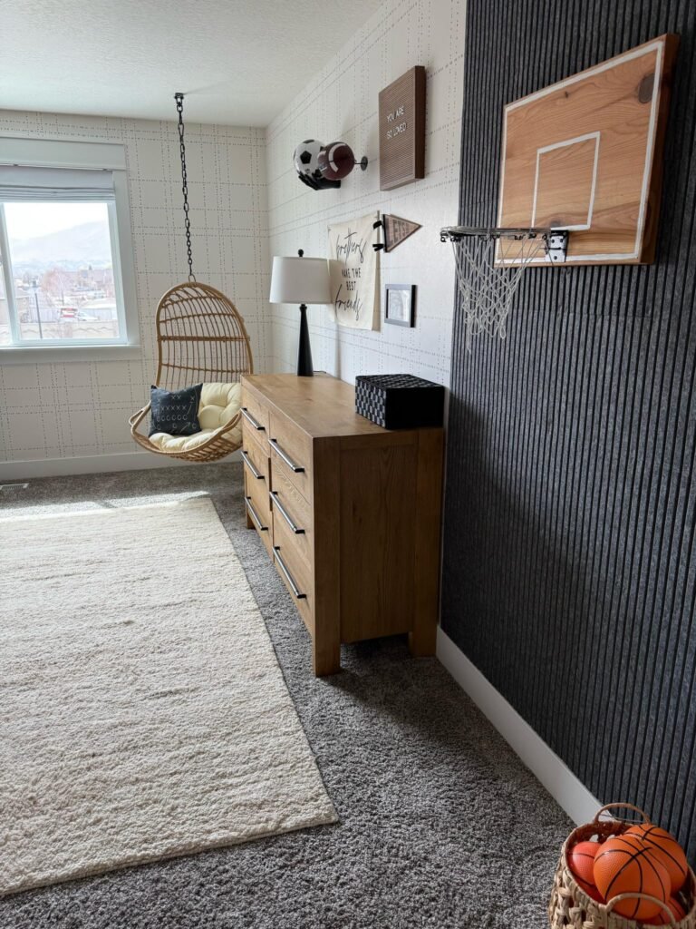 Boys sports-themed room with basketball wall