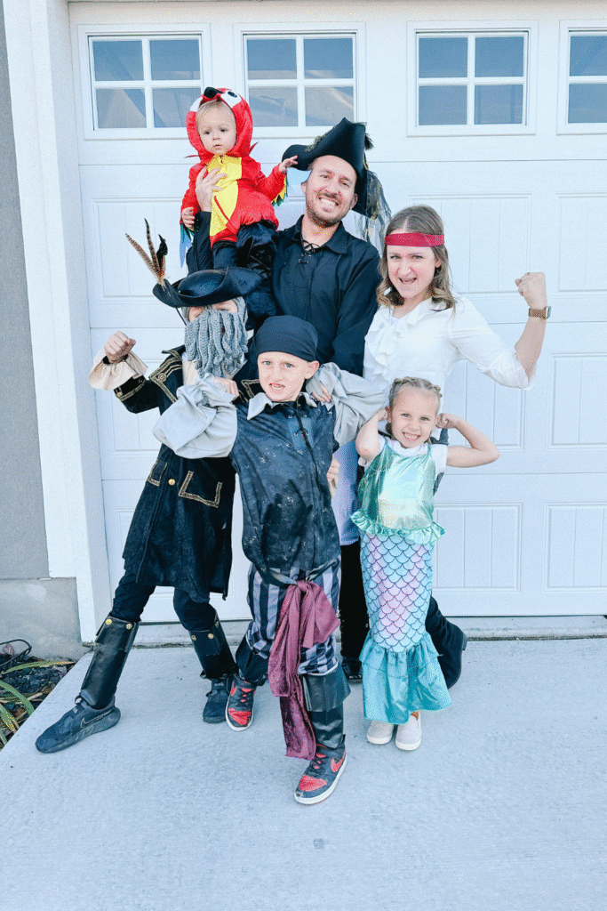 Pirate family Halloween costume: Pirates, mermaid, and parrot