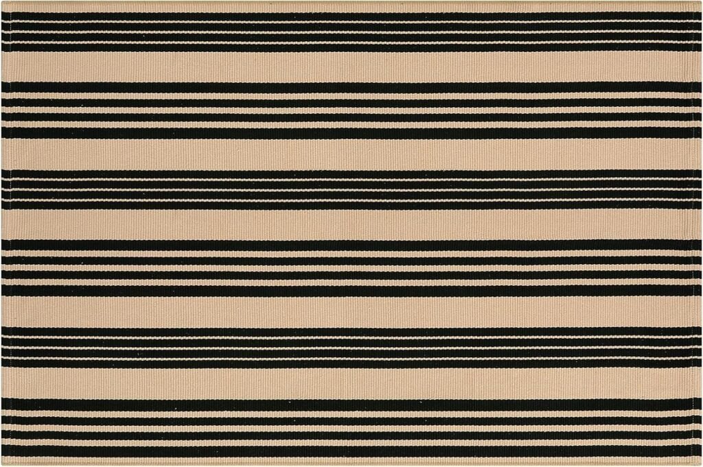 Black and tan striped area rug to go in front of the faux wood door