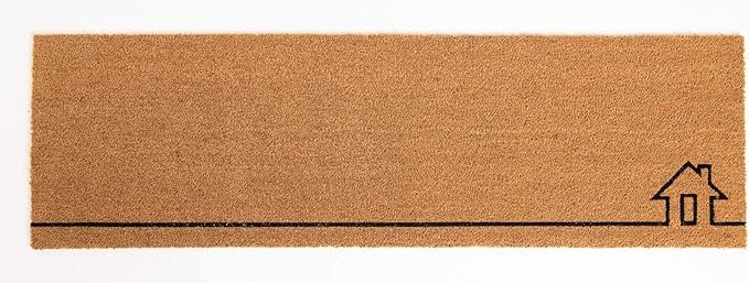 Welcome mat in front of the faux wood door