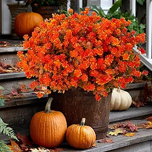 Faux fall flowers on porch with DIY pumpkin arch