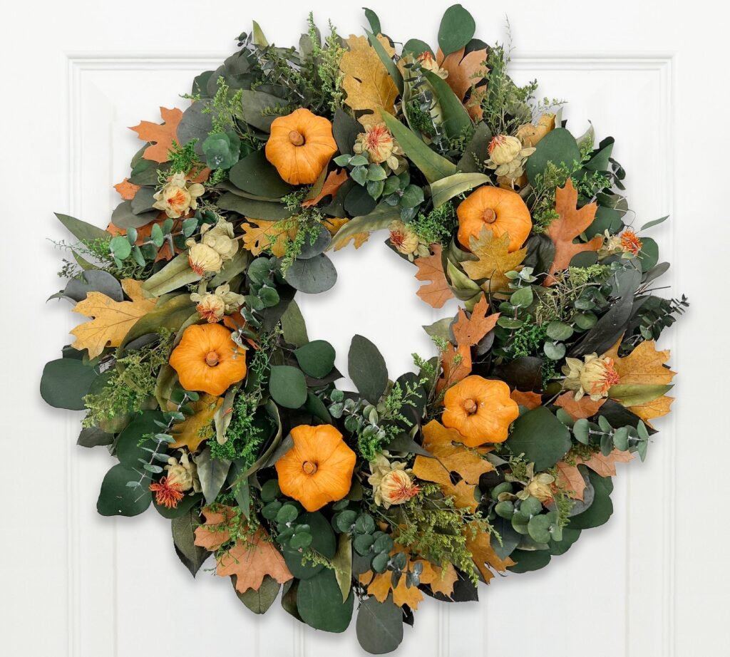 Dried Pumpkin Patch Wreath on porch with DIY pumpkin arch