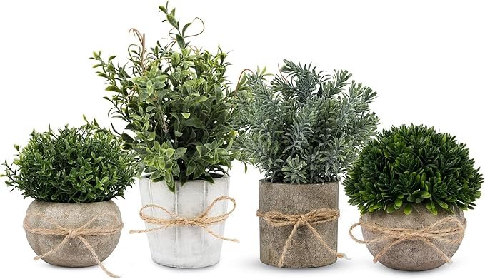 Small faux plants in cement planters