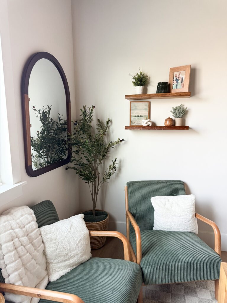 Midcentury modern green chairs and floating shelves