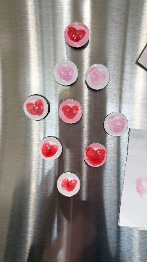 Fingerprint heart magnets on the fridge