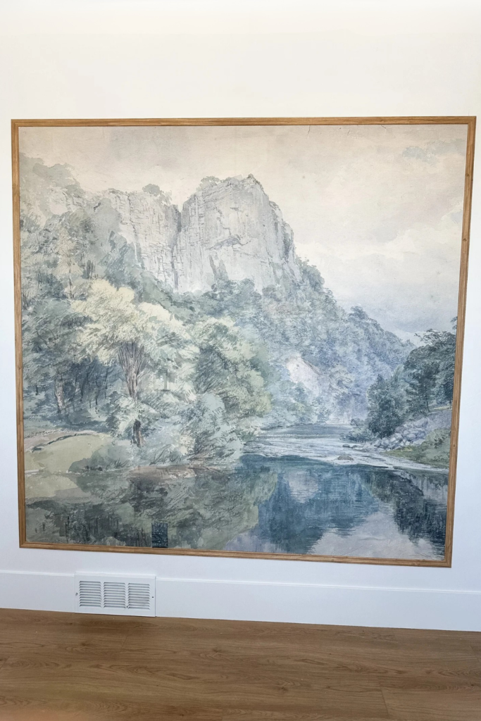 Weekend DIY Home Projects: Install a peel-and-stick wallpaper mural. This one is a forest scene with a pond and is framed with light oak trim.