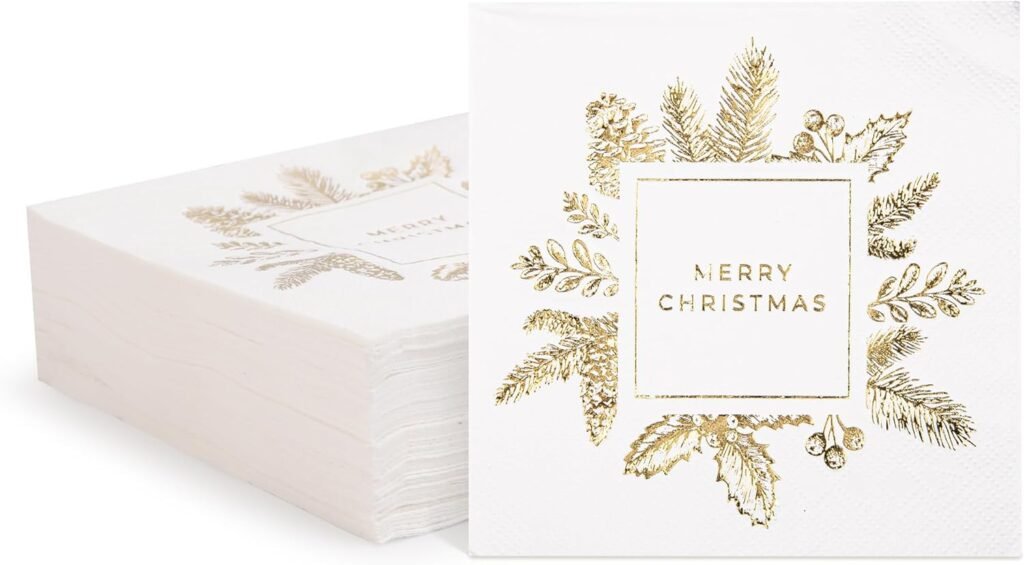 How to set a table: Add fun touches like these white and gold "Merry Christmas" napkins with stems and holly on it