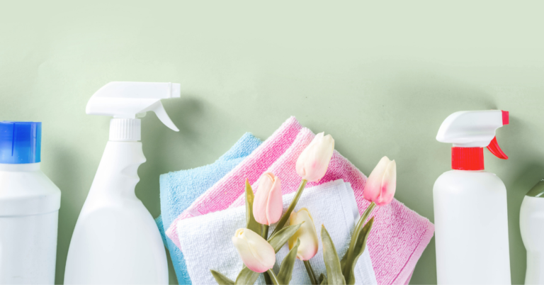 Green background and cleaning supplies and tulips