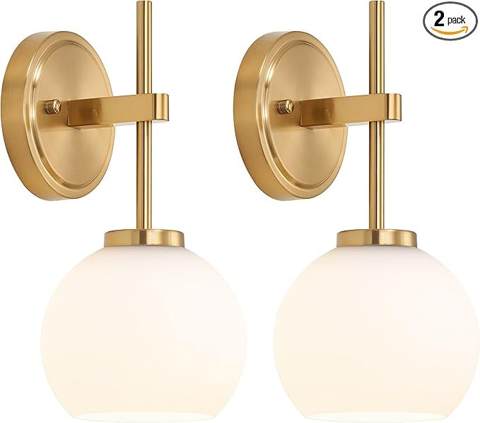 Gold sconces with round lightbulb covers