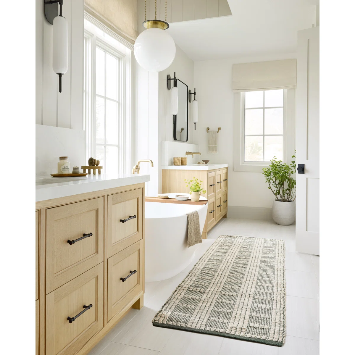 How to Choose a Rug You Love: Play off natural elements in the bathroom like wood cabinets, and white shiplap with a soft green and ivory striped runner