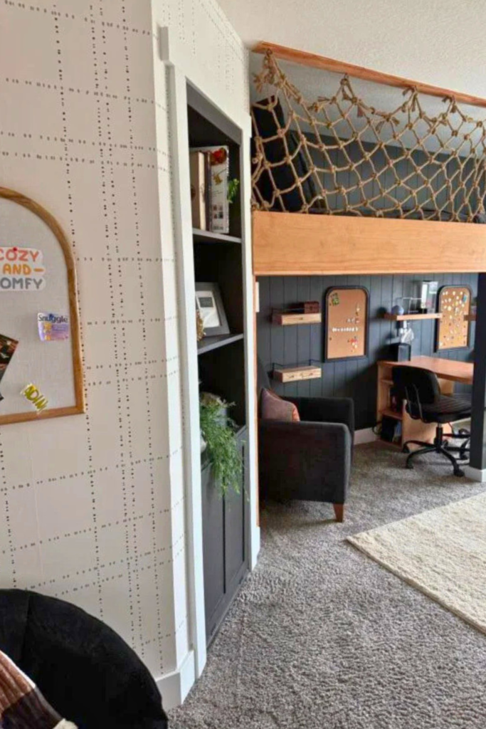 Black and white wallpaper on one wall and under the loft bed