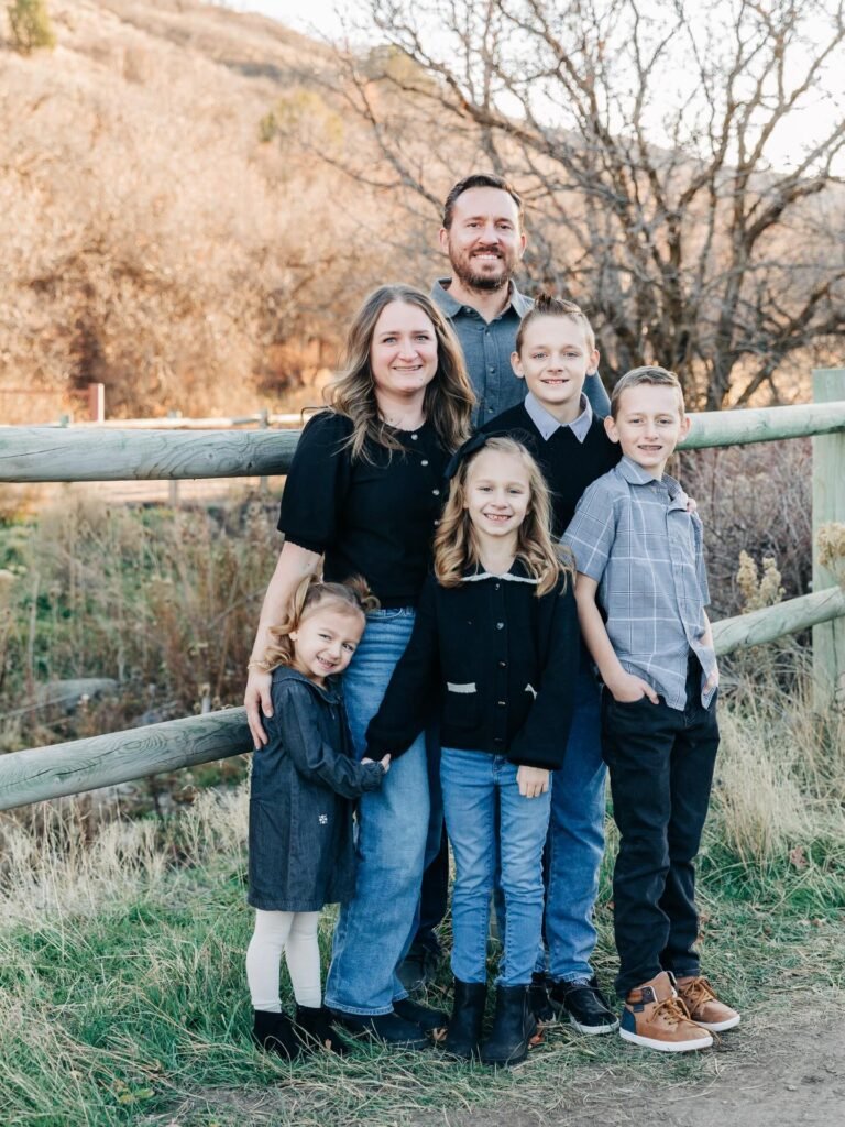 Family photo outfits example: family of 6 in black, gray, and denim