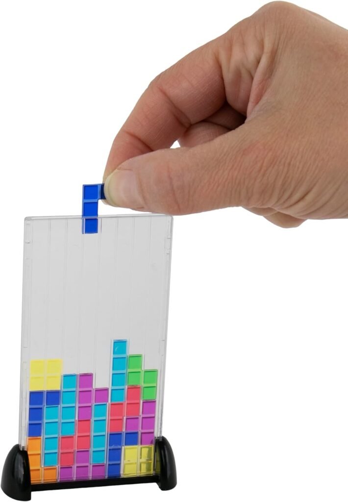 Hand holding mini tetris game