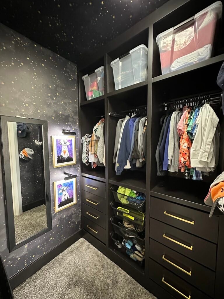 Cool Kids' Room Ideas: space-themed closet with night sky wallpaper; black IKEA Pax wardrobe unit