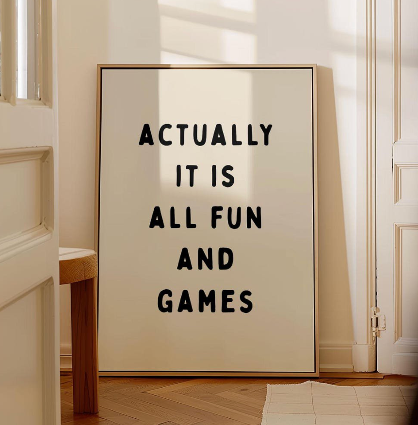 Canvas sign that reads "Actually it is all fun and games"