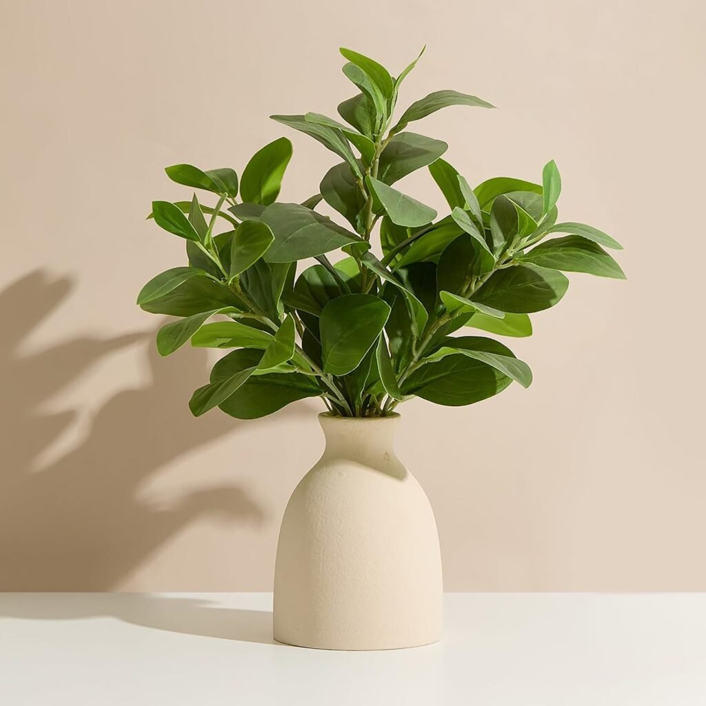 Shelf styling idea: Faux eucalyptus plant in a beige vase