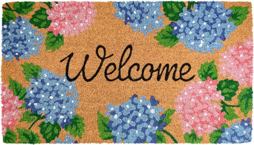 Door mat with pink and blue hydrangea border, cursive Welcome in the middle