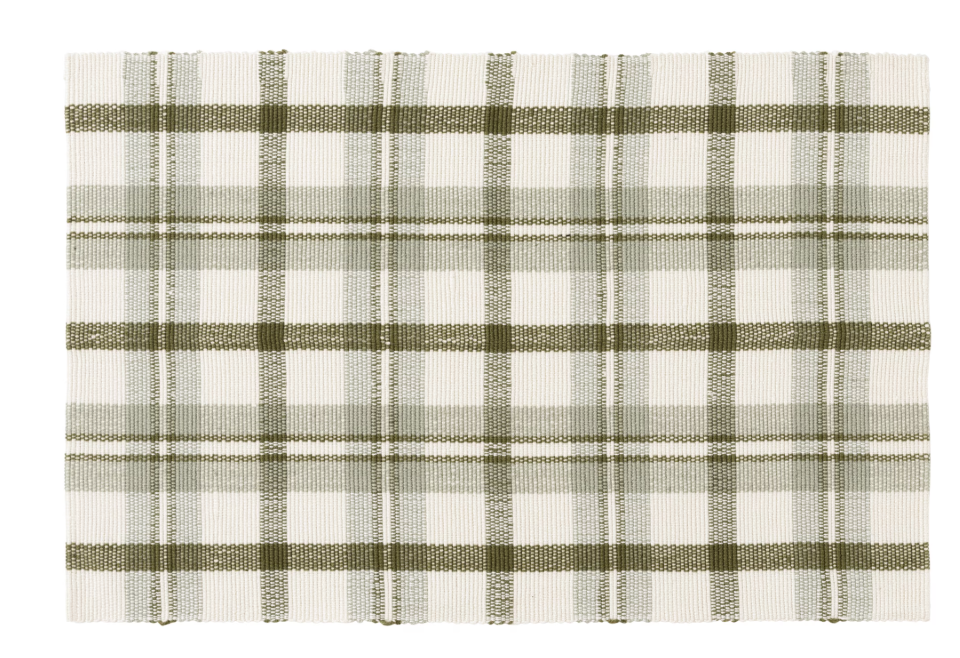 Forest green and cream plaid door mat. Layering rugs is a great way to create a cozy porch makeover!