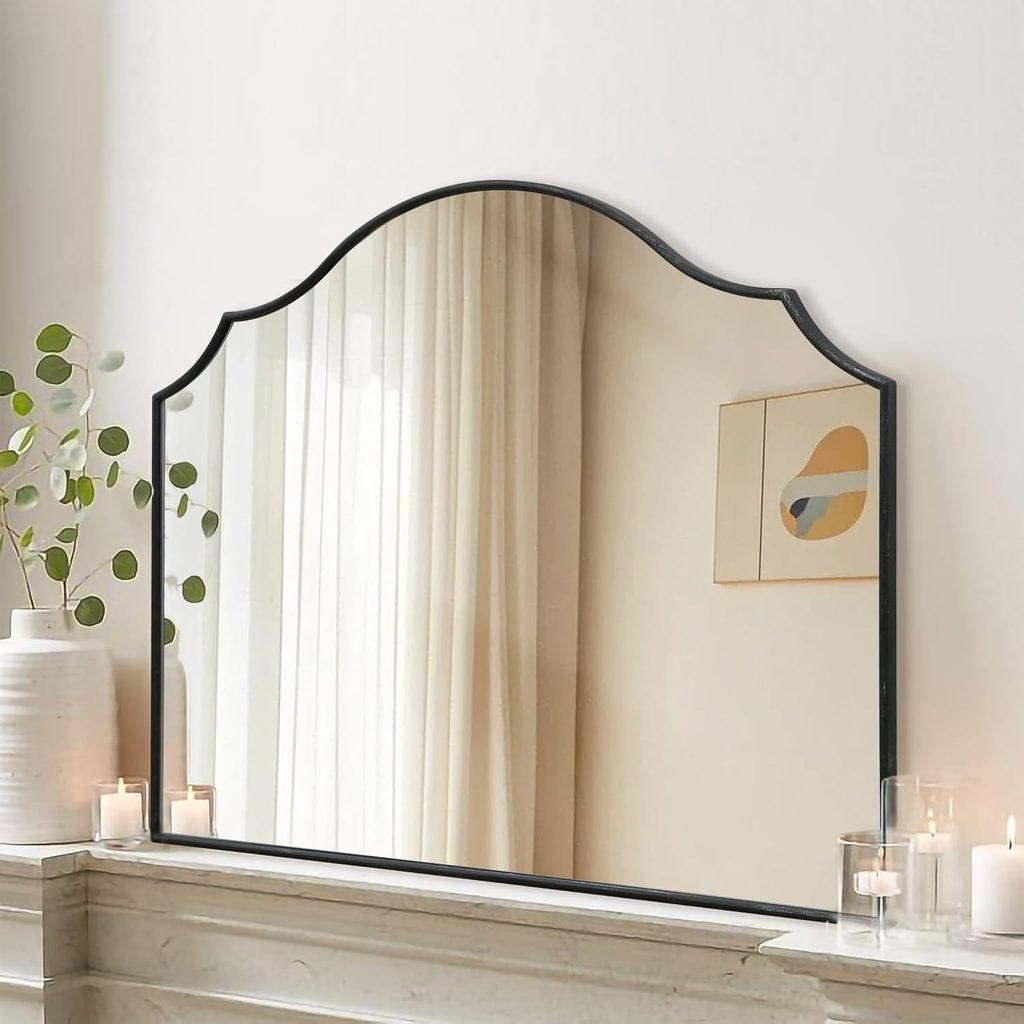 Example of how to style a mantel for every season: use a Black arch mirror as an anchor piece