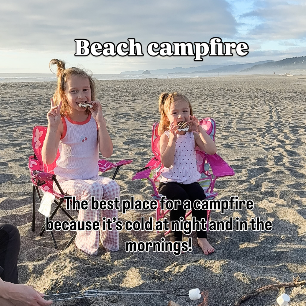 Oregon coast with kids idea: beach campfire. Image shows two girls sitting in pink camp chairs eating s'mores