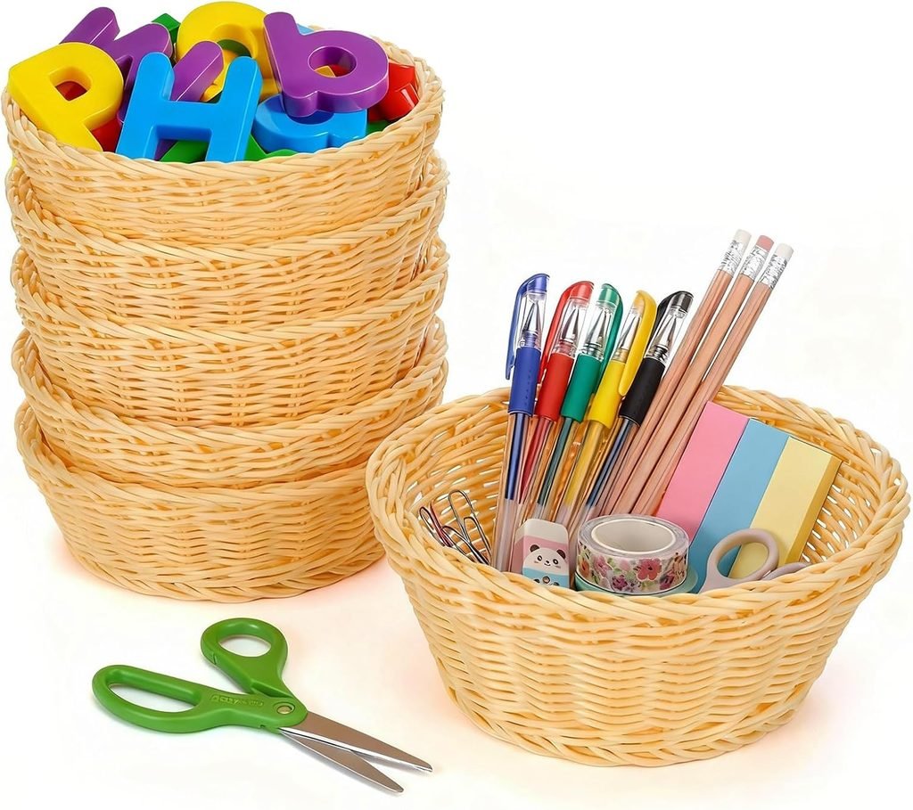 Small wicker baskets holding pens, washi tape, scissors, and magnetic letters