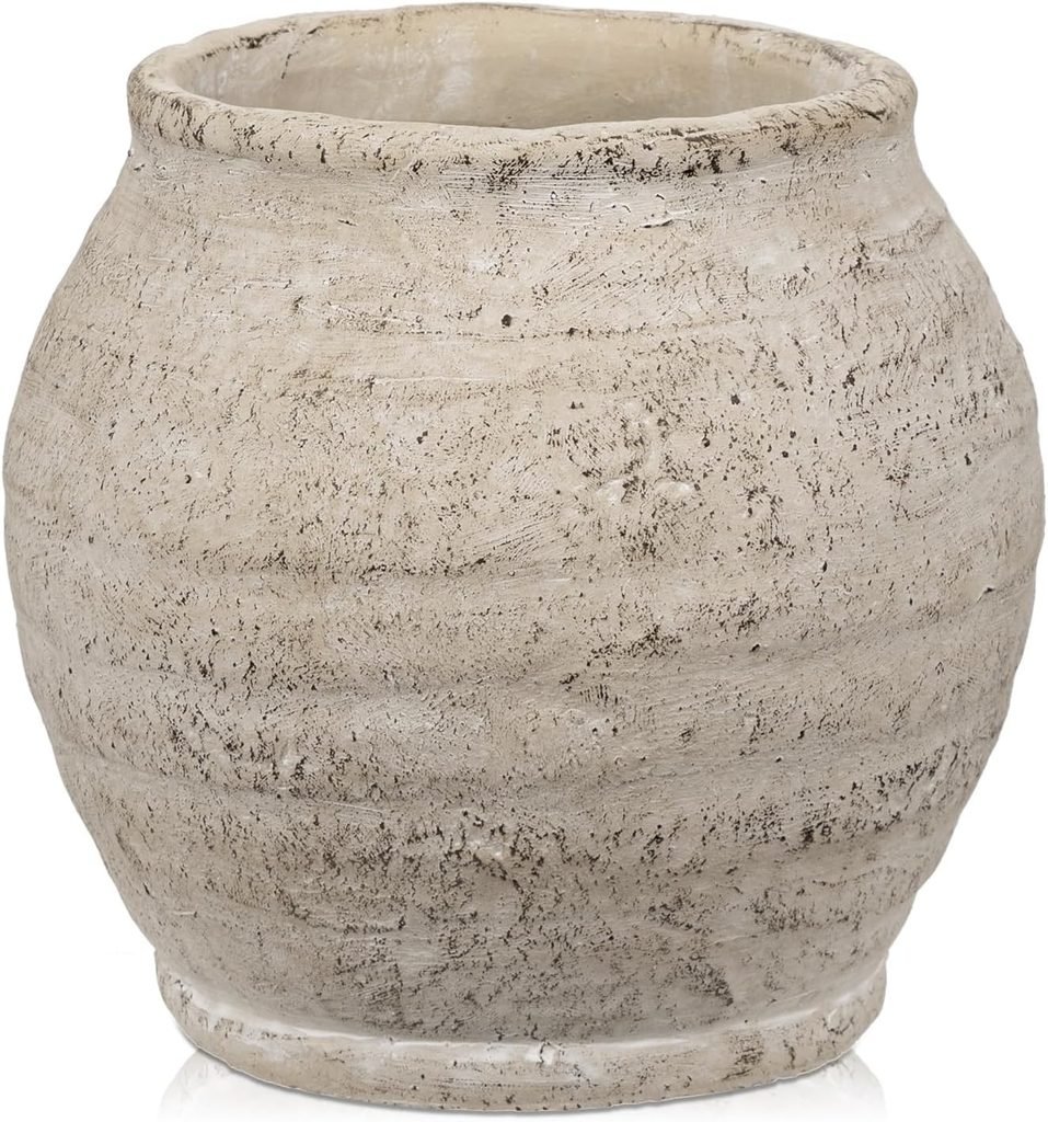 A textured cream/gray wide-mouth vase for a faux fall floral arrangement