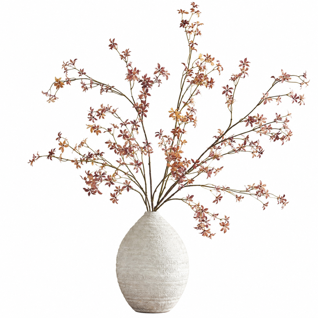 Red-brown branches in a white vase