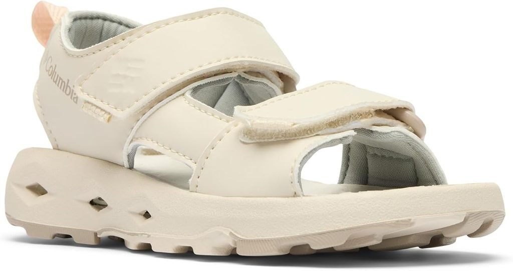 Cream kids’ sport sandals with hook-and-loop straps and drainage holes in the sole