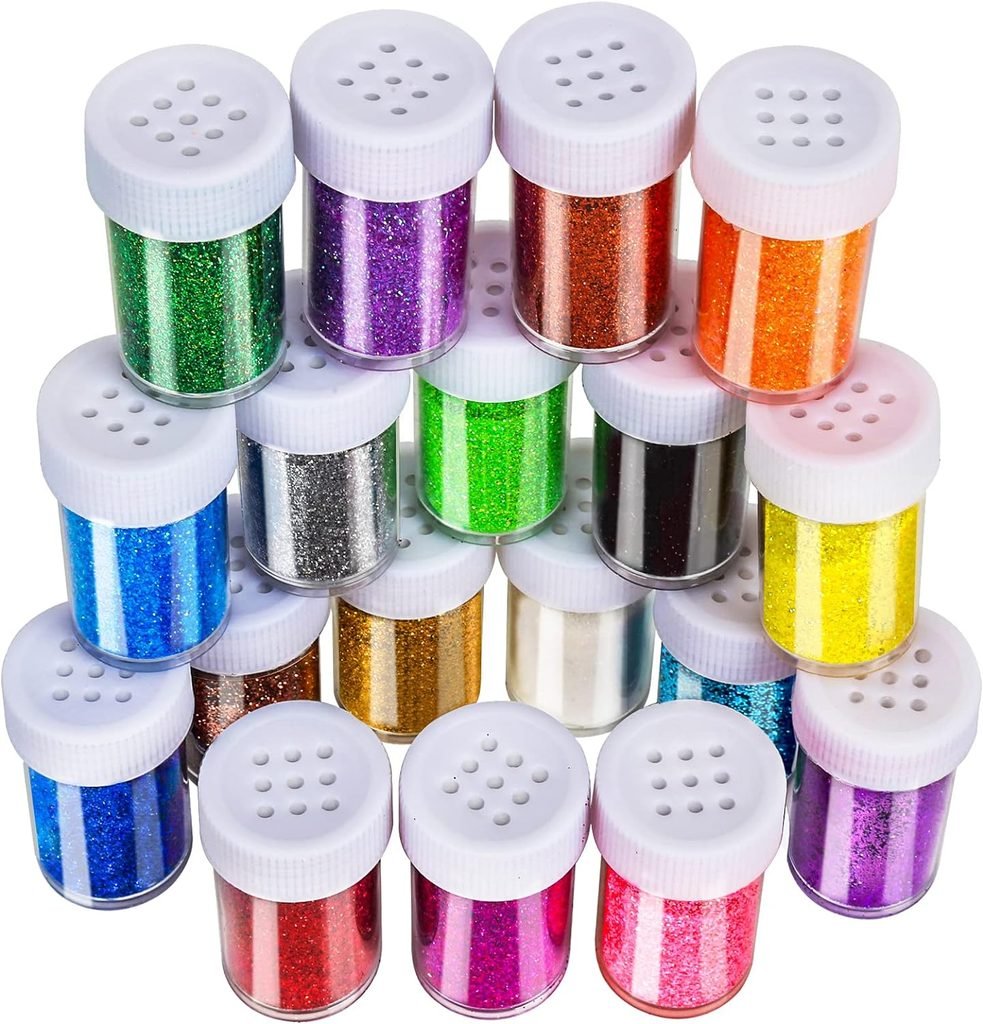 Rainbow glitter in white shaker containers for a kids' potion station