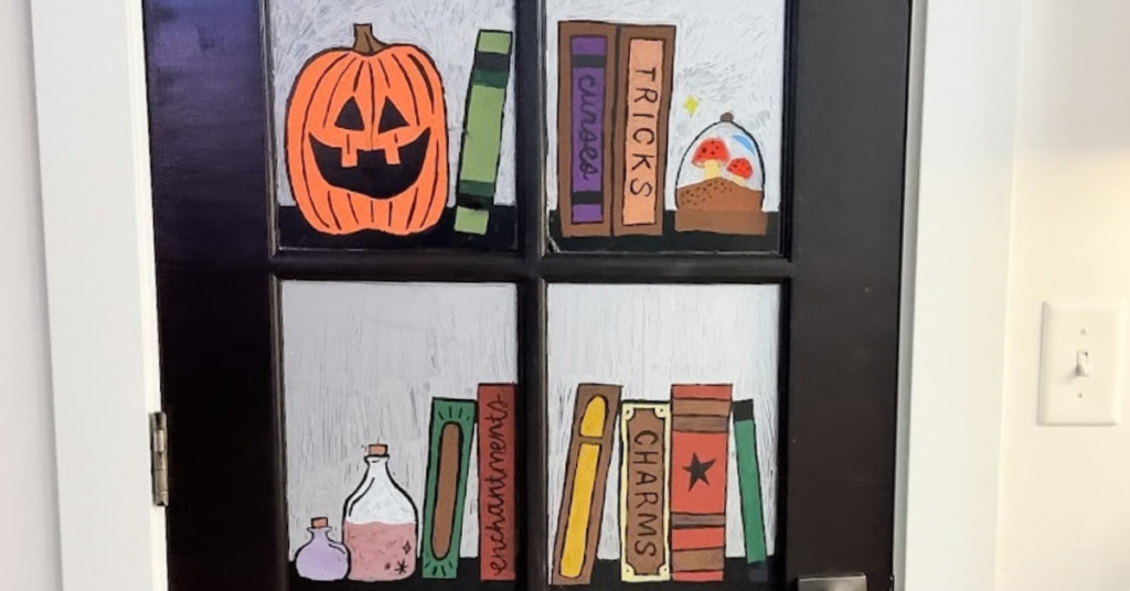 Easy Halloween Ideas for Kids: decorate a glass door with Halloween stencils and colorful chalk markers