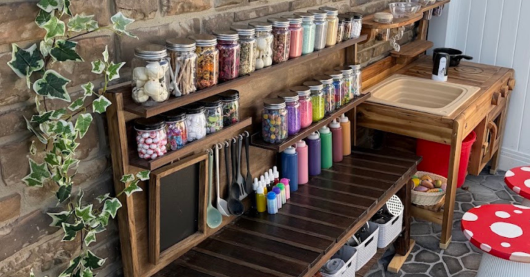 Kids' potion station set up on an outdoor mud kitchen
