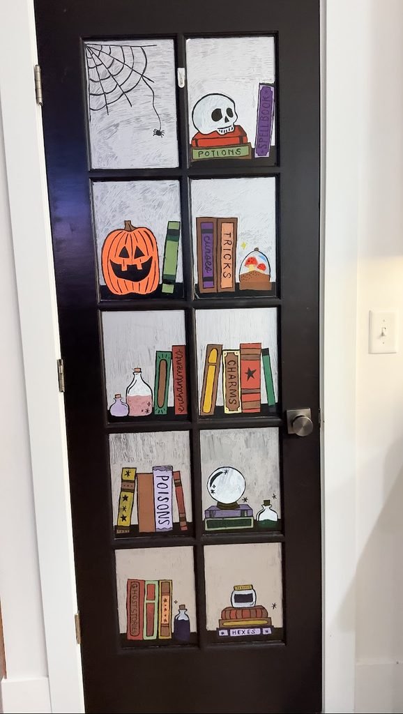 Easy Halloween Ideas for Kids: decorate a glass door with Halloween stencils and colorful chalk markers